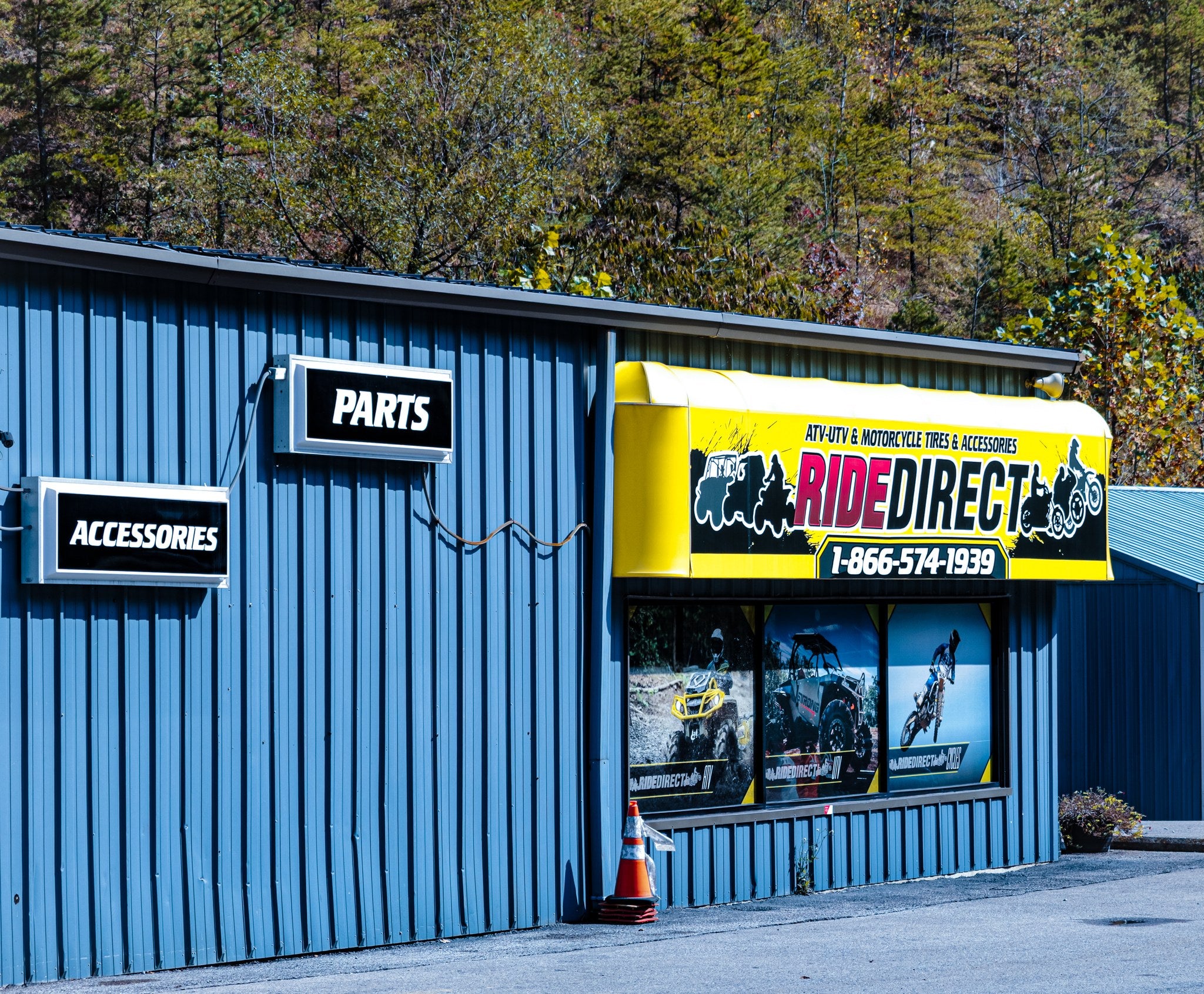 Blue building with a yellow and black awning displaying 'Ride Direct' branding.